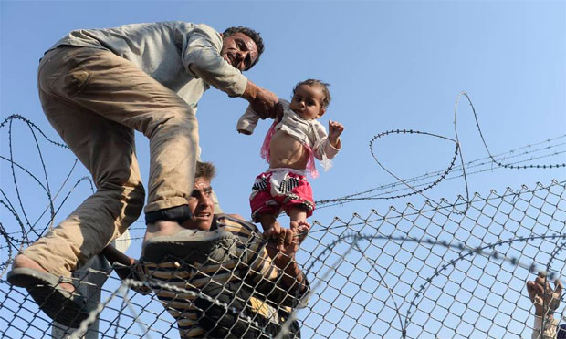 A fuga da guerra (Foto: AFP) A fuga da guerra (Foto: AFP)
