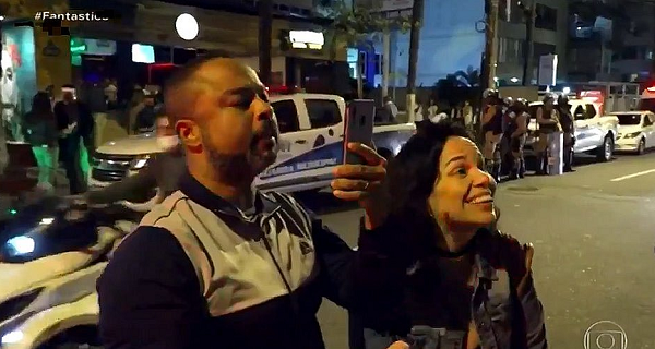 Fiscal da Vigilância Sanitária é atacado verbalmente por casal durante reportagem do Fantástico (Foto: Reprodução)
