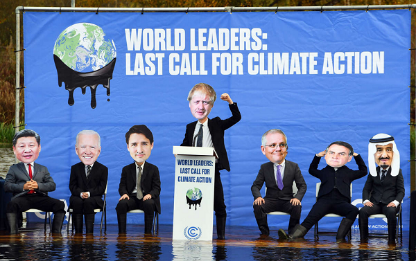 Protesto contra os líderes mundiais na COP26, entre eles o presidente do Brasil Jair Bolsonaro (Foto: Andy Buchaban/AFP)