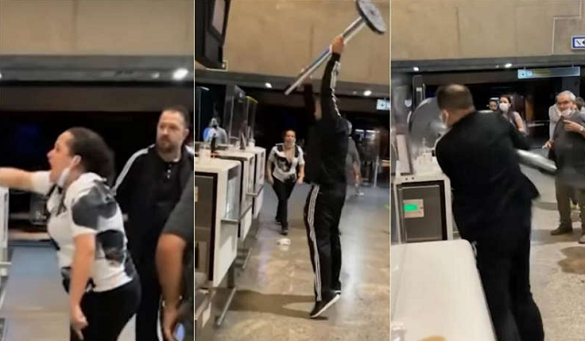 Homem quebra o guichê com um organizador de fila, tentando agredir os funcionários que estão atrás do balcão (Foto: Yuri Ferreira)