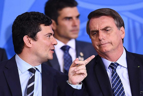Ex-ministro Sérgio Moro e o presidente da República, Jair Bolsonaro (Foto: Evaristo Sá/AFP)