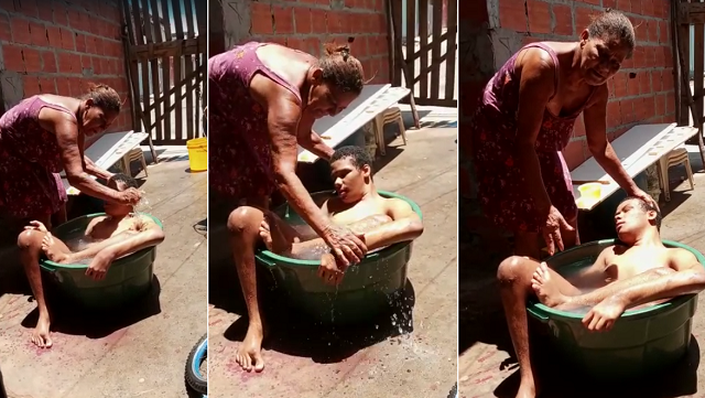 Dona Rosinete banhando seu filho, Tauan (Foto: Print/Vídeo/Redação CFF)