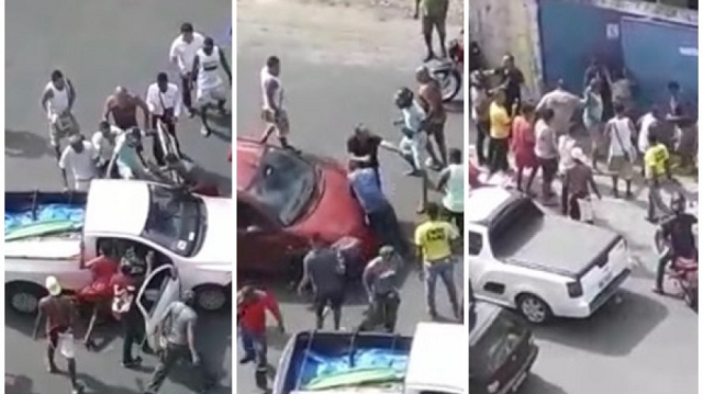 Vídeo mostra o momento em que o suspeito é retirado de dentro de um carro por populares com socos e chutes (Foto: Reprodução | Print) Vídeo mostra o momento em que o suspeito é retirado de dentro de um carro por populares com socos e chutes (Foto: Reprodução | Print)