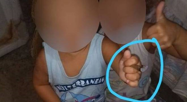 Foto da criança com cigarro de maconha foi enviada em aplicativo de mensagens (Foto: Reprodução)